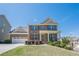 Beautiful two-story brick home with a well-maintained lawn and attached two-car garage at 1060 Crescent Ridge Dr, Buford, GA 30518