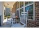 Inviting front porch features classic rocking chairs, perfect for relaxing outdoors at 1060 Crescent Ridge Dr, Buford, GA 30518