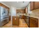 Spacious kitchen with a central island, stainless steel appliances, and ample cabinet space at 1060 Crescent Ridge Dr, Buford, GA 30518