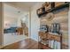 View of the living room with wood floors and custom wall decor featuring a coffee bar at 1060 Crescent Ridge Dr, Buford, GA 30518