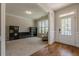 Cozy living room featuring plush carpet, natural light, and built-in storage solutions at 1060 Crescent Ridge Dr, Buford, GA 30518