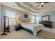 Spacious primary bedroom with tray ceilings, ample windows, and neutral carpet flooring at 1060 Crescent Ridge Dr, Buford, GA 30518