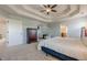 Spacious main bedroom featuring a tray ceiling and plush carpet at 1060 Crescent Ridge Dr, Buford, GA 30518