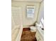 Bathroom with a tub, toilet and vanity features traditional fixtures and classic design elements at 1703 Stanton Sw Rd, Atlanta, GA 30311
