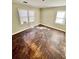 Bedroom featuring hardwood floors and natural light coming through two windows at 1703 Stanton Sw Rd, Atlanta, GA 30311