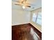 This cozy bedroom features hardwood floors, natural light, and a ceiling fan at 1703 Stanton Sw Rd, Atlanta, GA 30311