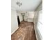 Eat-in kitchen with white cabinets and hardwood floors offers space for cooking and dining at 1703 Stanton Sw Rd, Atlanta, GA 30311