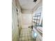 A bathroom undergoing repair, showing a tub/shower combo, sink, and damaged walls with peeling paint at 35 Belmont Way, Covington, GA 30016