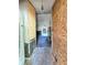Entryway featuring incomplete walls, old carpet, and a view into a living area with a fireplace at 35 Belmont Way, Covington, GA 30016