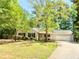 Charming single-story home with a well-manicured lawn and an attached two-car garage at 35 Belmont Way, Covington, GA 30016