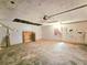 Garage featuring unfinished walls, and an exposed ceiling at 35 Belmont Way, Covington, GA 30016