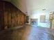Spacious living room featuring a fireplace, exposed studs, and wood paneling at 35 Belmont Way, Covington, GA 30016