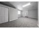 This unfinished basement features carpet flooring and white walls at 2374 Rolling Acres Sw Dr, Conyers, GA 30094