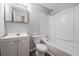 Clean bathroom with shower over tub combo, single vanity, and white tile at 2374 Rolling Acres Sw Dr, Conyers, GA 30094