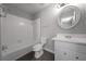 This is the home's bathroom with white tile and a vanity at 2374 Rolling Acres Sw Dr, Conyers, GA 30094