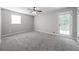 This bedroom features carpet flooring and a door to the outside at 2374 Rolling Acres Sw Dr, Conyers, GA 30094