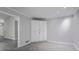 Bonus room featuring neutral paint, new floors and storage at 2374 Rolling Acres Sw Dr, Conyers, GA 30094