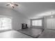 The living room showcases vaulted ceilings, fireplace, and great windows for tons of light at 2374 Rolling Acres Sw Dr, Conyers, GA 30094