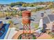 Aerial view of the city center and water tower along with parking and easy access to retail and restaurant locations at 3350 Hillshire Dr, Cumming, GA 30028