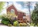 Two-story brick home featuring a wooden deck and well-maintained landscaping at 3759 Wescott Ne Cv, Brookhaven, GA 30319