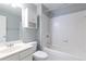 This full bathroom features a shower and bathtub combination, a white vanity and grey walls at 3759 Wescott Ne Cv, Brookhaven, GA 30319