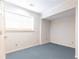 Spare bedroom features neutral paint, carpet, and a window at 3759 Wescott Ne Cv, Brookhaven, GA 30319