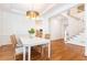 Dining area with chandelier and view of the staircase and kitchen at 3759 Wescott Ne Cv, Brookhaven, GA 30319