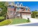 Beautiful two-story home with stone accents, manicured lawn, and a two-car garage at 3759 Wescott Ne Cv, Brookhaven, GA 30319