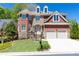 Elegant two-story home with a combination brick and stone facade and a two-car garage at 3759 Wescott Ne Cv, Brookhaven, GA 30319