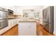Bright, open kitchen with granite countertops, stainless steel appliances, and hardwood floors at 3759 Wescott Ne Cv, Brookhaven, GA 30319