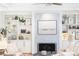Cozy living room featuring a marble fireplace, custom built-in shelves, and neutral decor at 3759 Wescott Ne Cv, Brookhaven, GA 30319