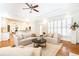 Spacious living room with hardwood floors, fireplace, built-in shelving, and coffered ceiling at 3759 Wescott Ne Cv, Brookhaven, GA 30319
