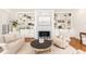 Comfortable living room featuring a fireplace with marble surround and built-in shelving at 3759 Wescott Ne Cv, Brookhaven, GA 30319