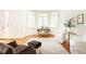 Stylish living room with hardwood floors and large windows with wooden shutters at 3759 Wescott Ne Cv, Brookhaven, GA 30319
