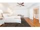 A spacious main bedroom features hardwood floors, a ceiling fan and an ensuite bathroom at 3759 Wescott Ne Cv, Brookhaven, GA 30319