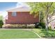 Brick home featuring a well-maintained lawn and colorful flower beds at 3759 Wescott Ne Cv, Brookhaven, GA 30319