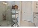 Modern bathroom features a glass shower, white towels, and a storage rack at 518 Coral St, Marietta, GA 30064