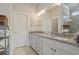 Elegant bathroom boasts dual sinks, granite countertops, and a glass-enclosed shower at 518 Coral St, Marietta, GA 30064