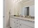 Granite vanity with dual sinks and white cabinetry in bathroom at 518 Coral St, Marietta, GA 30064