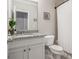 Bathroom featuring granite countertops, modern fixtures, and a tiled shower at 518 Coral St, Marietta, GA 30064