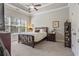 Serene bedroom with a tray ceiling, a large window and neutral décor at 518 Coral St, Marietta, GA 30064