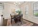 Bright dining room with elegant chandelier, large windows, and classic decor, perfect for entertaining guests at 518 Coral St, Marietta, GA 30064