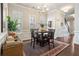 Charming dining room featuring a vintage rug, chandelier, and natural light, enhancing the room's appeal at 518 Coral St, Marietta, GA 30064