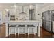 Stylish kitchen island with seating, pendant lighting, and stainless steel appliances, blending style with functionality at 518 Coral St, Marietta, GA 30064