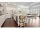 Open-concept kitchen with stainless steel appliances, white cabinetry, and a spacious island overlooking the living area at 518 Coral St, Marietta, GA 30064
