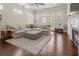 Open-concept living room offers a comfortable seating area, large windows, and hardwood floors at 518 Coral St, Marietta, GA 30064