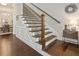 Stunning staircase with dark wood treads and wrought iron railings, showcasing the home's craftsmanship at 518 Coral St, Marietta, GA 30064