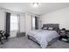 Serene bedroom featuring neutral tones, carpeted floors, and ample natural light at 5638 Berney Cir, Powder Springs, GA 30127