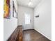 Bright entryway features hardwood floors, a bench, and modern decor, offering a welcoming transition at 5638 Berney Cir, Powder Springs, GA 30127
