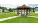 Community gazebo offers an outdoor gathering space surrounded by lush green lawn and walking paths at 5638 Berney Cir, Powder Springs, GA 30127